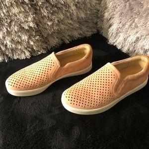 Pink Dr. Scholl’s slip ons.